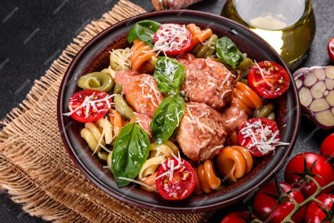 delicious-fresh-pasta-with-meatballs-sauce-cherry-tomatoes-basil_73989-117890