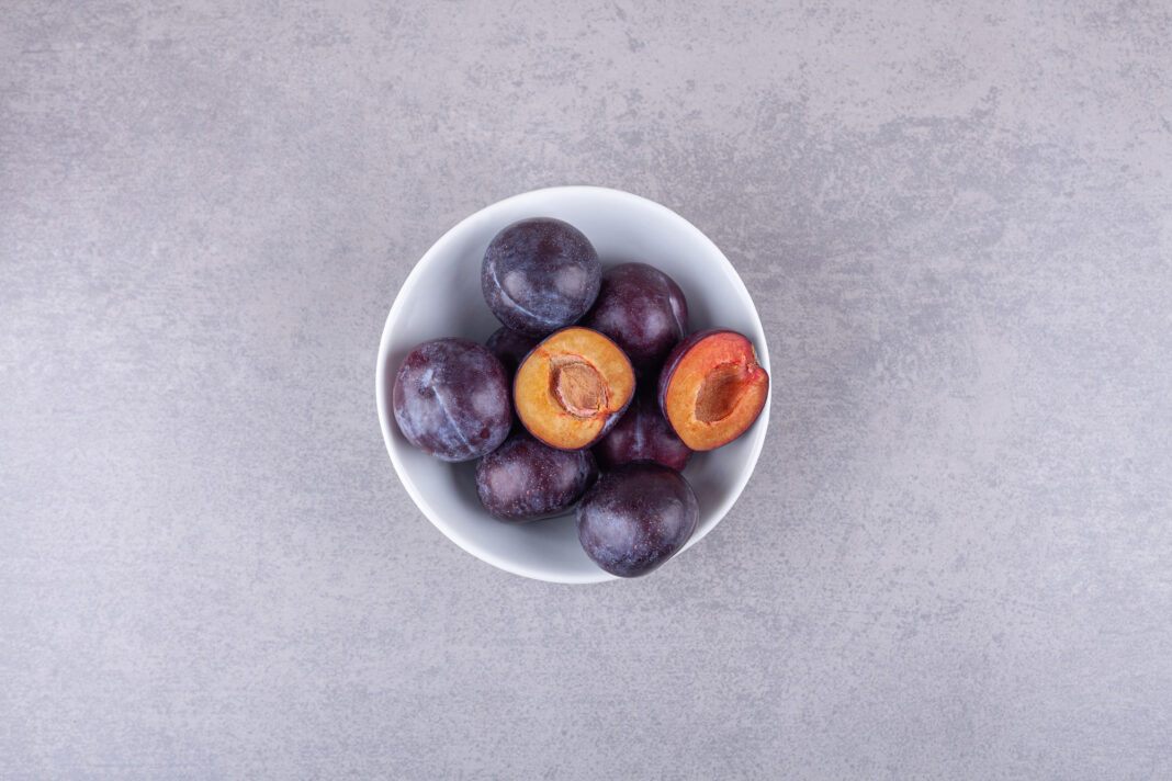 bunch-fresh-purple-plums-placed-white-bowl0