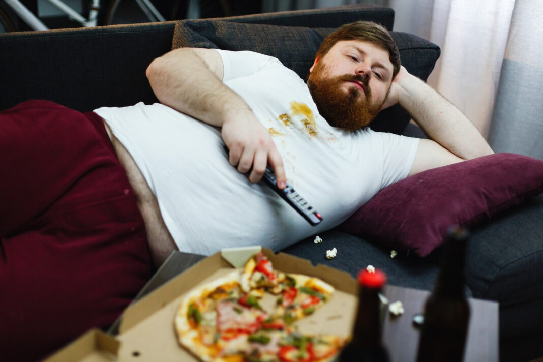 sad-fat-man-lies-sofa-watches-tv0