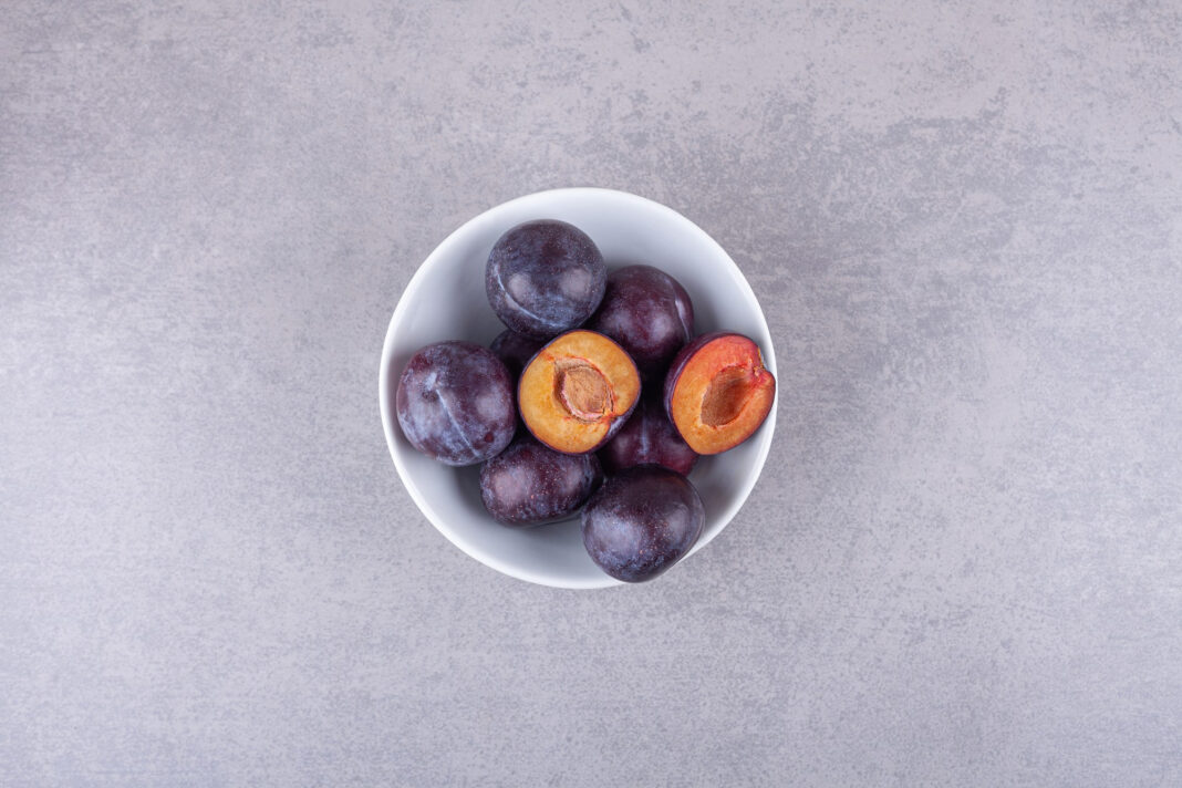 bunch-fresh-purple-plums-placed-white-bowl0