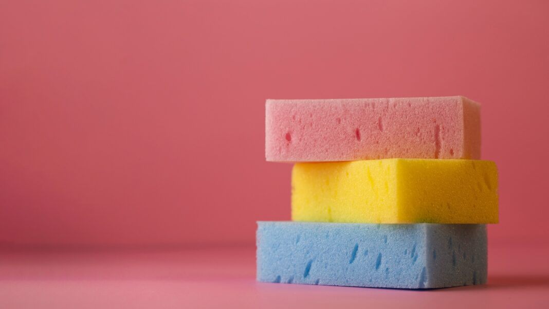 top-view-of-sponges-on-plain-background-with-copy-space0