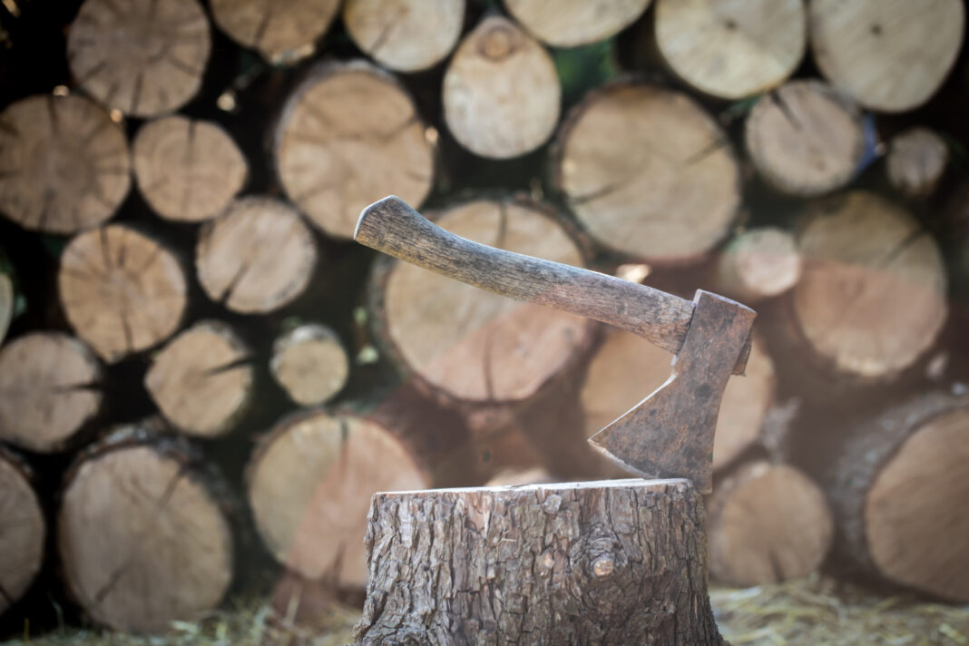 a-deck-of-stacked-logs-and-an-axe0